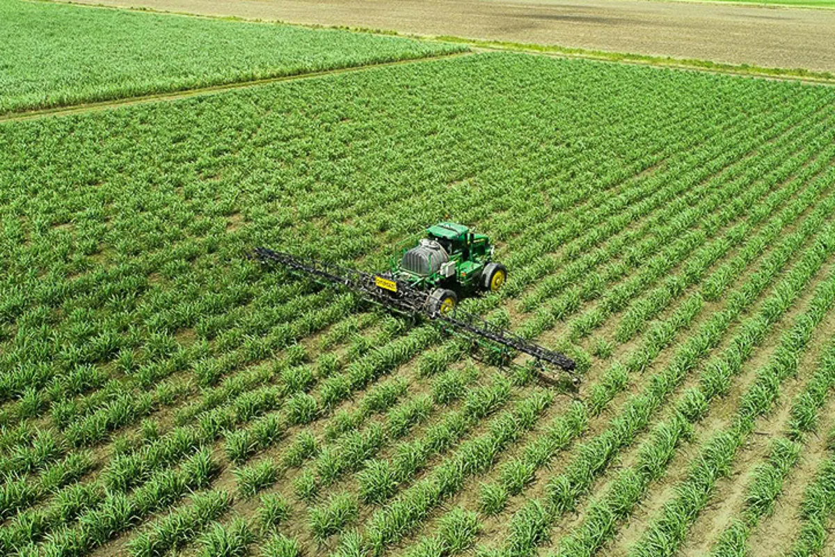 A spray rig working a cane paddock