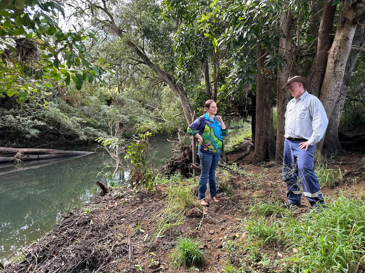 Landholders inspecting a revegetated creek bank